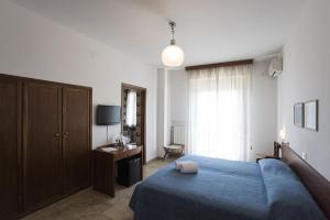 En eller flere senge i et værelse på Albergo Rossana