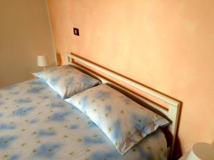 Łóżko lub łóżka w pokoju w obiekcie Casa Angela
