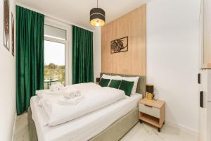 Ένα ή περισσότερα κρεβάτια σε δωμάτιο στο Apartament Eco Modern IV z Basenem Letnim by HolidaySun +22 φωτογραφίες