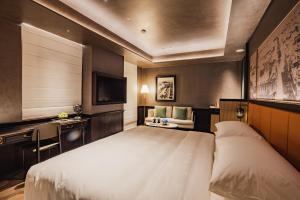Voodi või voodid majutusasutuse Hotel Central 新中央酒店 toas