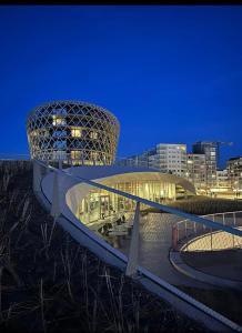 a view of a building in a city at night at Cintra in Middelkerke