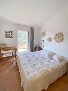 Posteľ alebo postele v izbe v ubytovaní Les Terrasses de Scalegiu