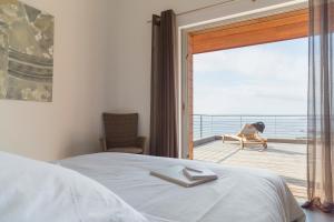 Posteľ alebo postele v izbe v ubytovaní Les Terrasses de Scalegiu