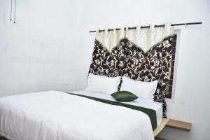 Postel nebo postele na pokoji v ubytování Dream inn family homestay