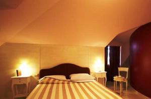 Llit o llits en una habitació de Palace Hotel Una Nuova Strada