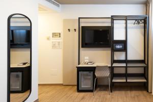 TV a/nebo společenská místnost v ubytování Hotel Astoria