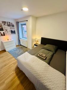 a bedroom with a bed with a purse on it at 115qm Ferienwohnung am Steinhuder Meer, ruhige Lage, Terrasse, WiFi, Parkplatz in Wunstorf