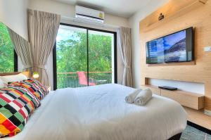Postel nebo postele na pokoji v ubytování The Title Boutique Phuket + 37 fotografií