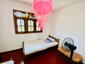 Ένα ή περισσότερα κρεβάτια σε δωμάτιο στο Hamba Hostel for Safari