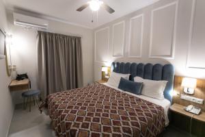 Posteľ alebo postele v izbe v ubytovaní Paradise Hotel