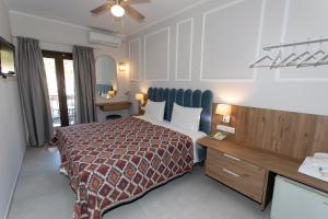 Posteľ alebo postele v izbe v ubytovaní Paradise Hotel