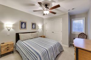 a bedroom with a bed and a ceiling fan at Beautiful cottage next to Tims Ford Lake in Tullahoma