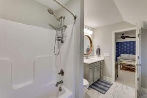 a bathroom with a shower and a toilet and a sink at Beautiful cottage next to Tims Ford Lake in Tullahoma +38 photos