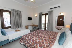 Posteľ alebo postele v izbe v ubytovaní Paradise Hotel