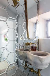 a bathroom with a sink and a mirror at Casa Iris in Orbetello