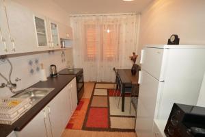 Kuchyň nebo kuchyňský kout v ubytování Sole Mio Apartment