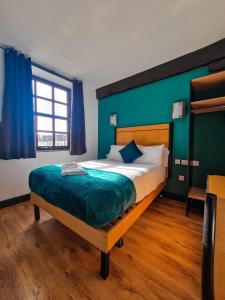 Voodi või voodid majutusasutuse Cornmill Hotel toas