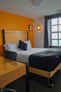 Voodi või voodid majutusasutuse Cornmill Hotel toas