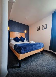 Voodi või voodid majutusasutuse Cornmill Hotel toas