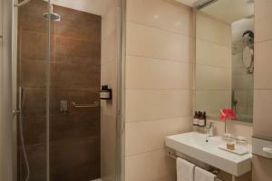 a bathroom with a shower and a sink at NH Orio Al Serio in Orio al Serio