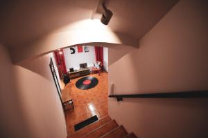 an overhead view of a living room with a light at Music Xperience Studio- comfy basement for Music Lovers in Timişoara