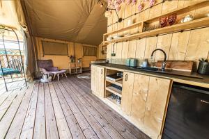 an interior view of a kitchen in a tent at Liva Park Glamp in Liwa