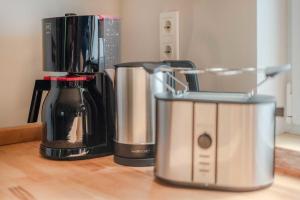 two appliances sitting on top of a wooden counter at Kormoran in Ueckeritz