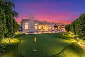 a house with a golf course in front of it at Anderson LUX Estate Private Bar&Pool Sleeps 12 in Phoenix