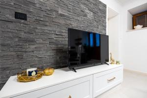 TV a/nebo společenská místnost v ubytování Studio Apartman Tonka