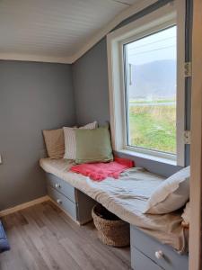 Postel nebo postele na pokoji v ubytování Fredvang Farm House, Lofoten