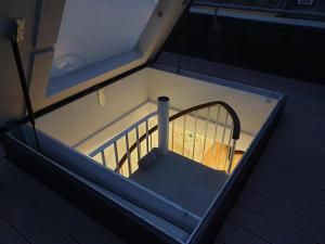 an empty bunk bed in a room with a flashlight at ROOFTOP with stunning views in Zurich