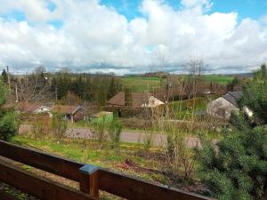 a view of a farm from a fence at Le gîte de la Racine "La Verte Vallée" in Raon-aux-Bois
