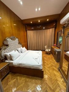 En eller flere senge i et værelse på CASTELLO HOTEL