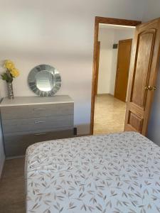 En eller flere senge i et værelse på Sunrise beach