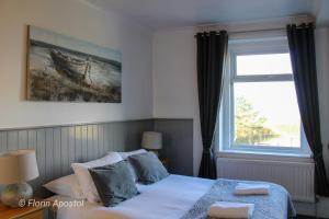 Säng eller sängar i ett rum på The Wight Mouse Inn