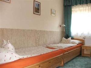Кровать или кровати в номере Lukács Ház