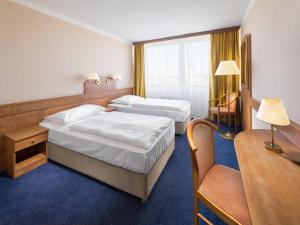 Voodi või voodid majutusasutuse Hotel Cernigov toas