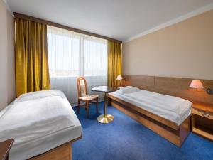 Voodi või voodid majutusasutuse Hotel Cernigov toas