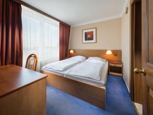 Voodi või voodid majutusasutuse Hotel Cernigov toas