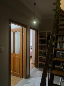 a room with a wooden door and a staircase at Kiralık in Istanbul