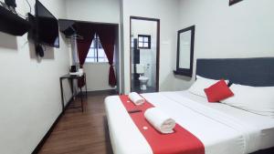 Postel nebo postele na pokoji v ubytování Hotel Rasa Sayang 2