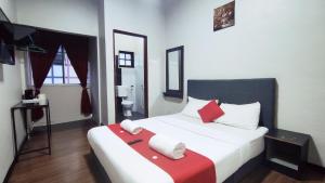 Postel nebo postele na pokoji v ubytování Hotel Rasa Sayang 2