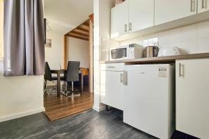 Kuchyňa alebo kuchynka v ubytovaní Ocean Apartment