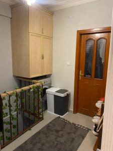 a kitchen with a stove and a cabinet and a door at Kiralık in Istanbul