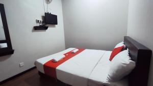 Postel nebo postele na pokoji v ubytování Hotel Rasa Sayang 2
