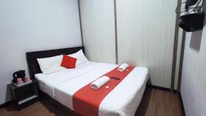 Postel nebo postele na pokoji v ubytování Hotel Rasa Sayang 2
