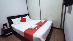 Postel nebo postele na pokoji v ubytování Hotel Rasa Sayang 2
