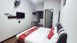 Postel nebo postele na pokoji v ubytování Hotel Rasa Sayang 2