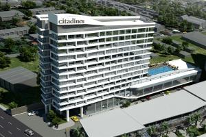 an overhead view of a building with a swimming pool at Citadines Bacolod City in Bacolod