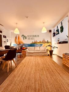 a living room with a couch and a table at Mediterranean Hostel Barcelona in Barcelona